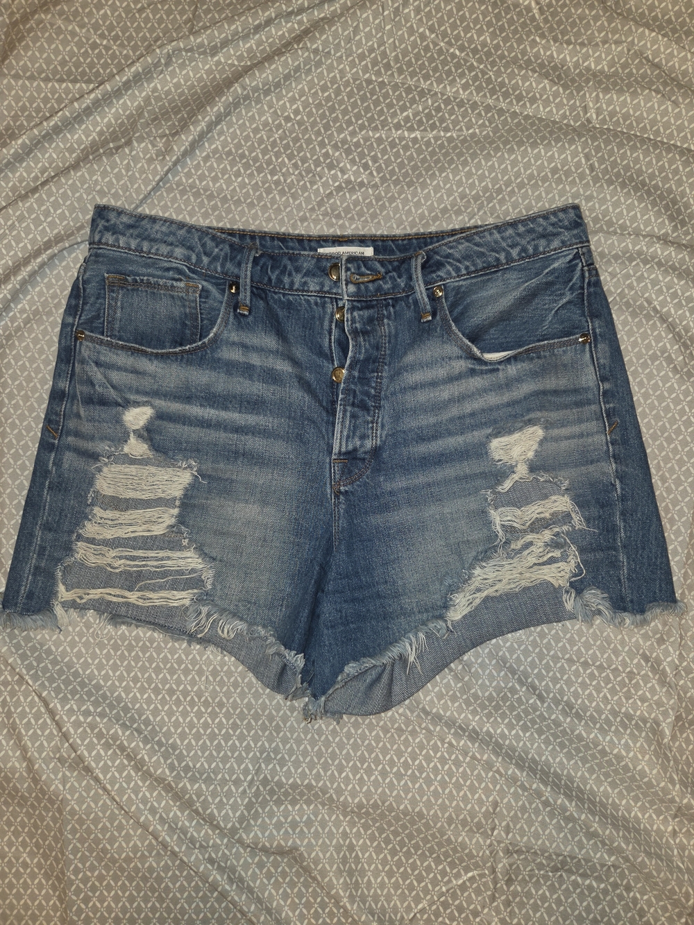 Good American Distressed Blue Denim Cutoff Shorts